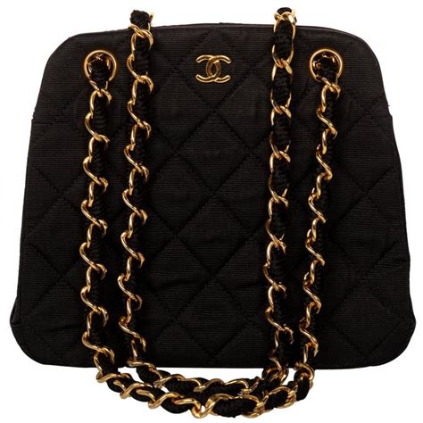 chanel purse black gold chain|Chanel quilted bag gold chain.